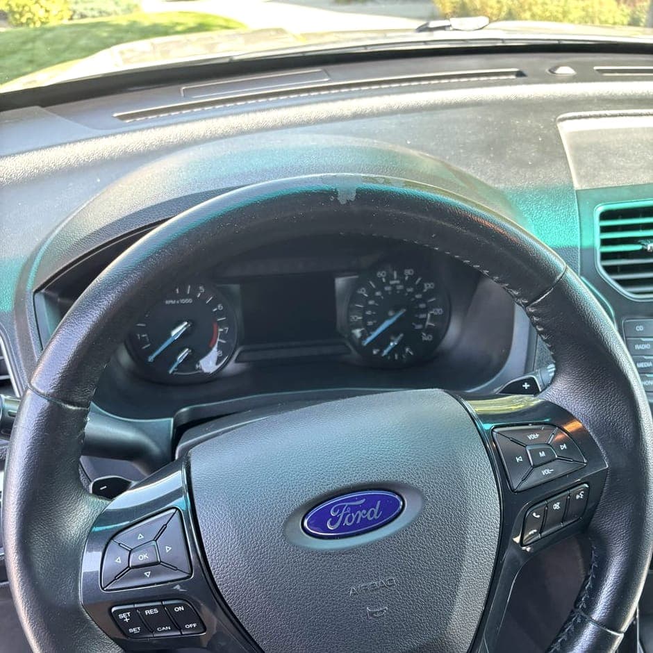 Steering wheel and switch gear being wiped down by hand